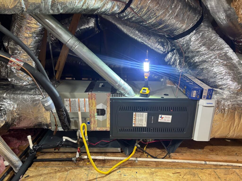 New American Standard furnace and evaporator coil installation with AprilAire air filtration in a Cypress, TX attic by Texas Star Heating & Cooling